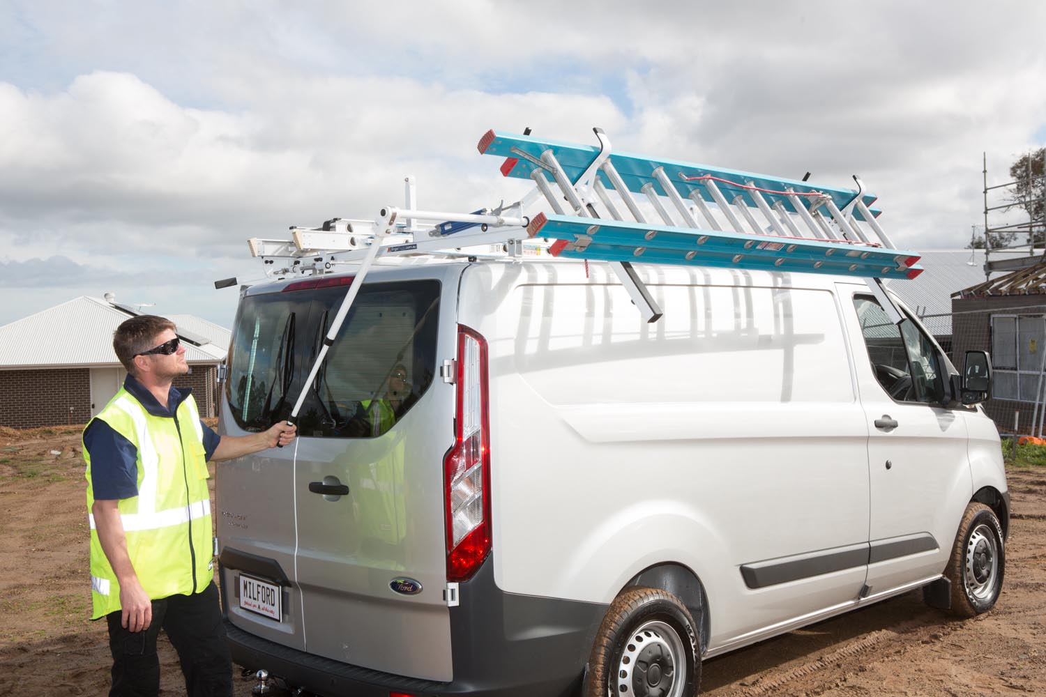 Man operating Ergorack on van